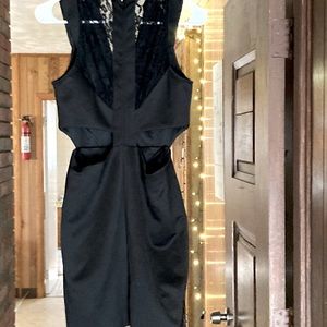 Black sleeveless mini dress. Size medium made by Jealous Tomato clothing company